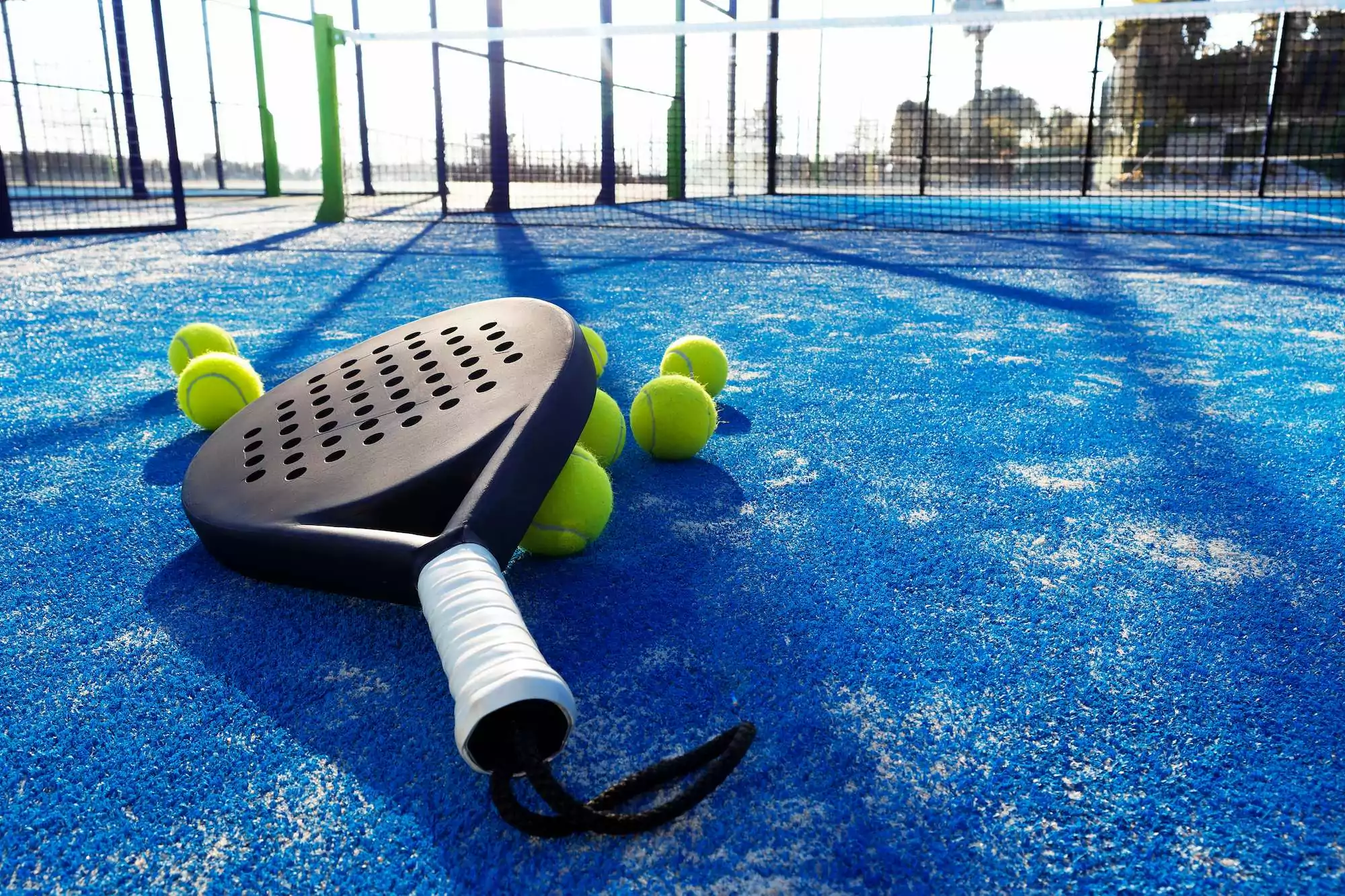 Padel court with racket and balls