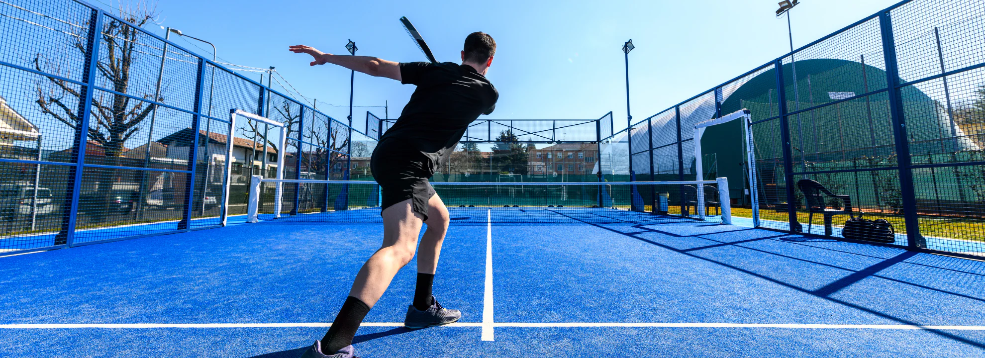 Padel player in action on court